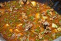 Preparing a hungarian goulash cooked in a stew-pot Royalty Free Stock Photo