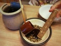 Preparing Japanese condiments.