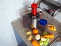 Preparing juice from fresh fruits and vegetables. Royalty Free Stock Photo