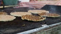 Preparing large burgers on the grill