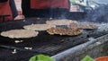 Preparing large burgers on the grill