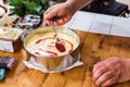 Preparing lemon curd cheesecake with strawberries Royalty Free Stock Photo