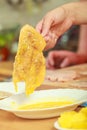 Preparing meal of breaded chicken cutlets