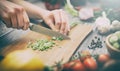 Preparing a meal. Cutting vegetables.