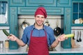 Preparing meal. Healthy food. Professional kitchen. Traditional cuisine. Man at kitchen concept. Fresh veggies. Handsome Royalty Free Stock Photo