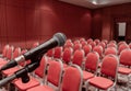 Preparing microphone on podium of conference hall or seminar room event Royalty Free Stock Photo