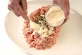 Preparing mince to make meatballs