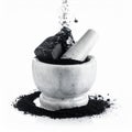 Preparing Natural Charcoal Powder in a Marble Mortar Royalty Free Stock Photo