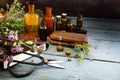 Preparing natural medicine, healing herbs, scissors and apotheca Royalty Free Stock Photo