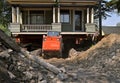 Preparing for a new foundation on a huge old house Royalty Free Stock Photo