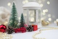 Preparing for the New year, decorated Christmas trees and gift boxes. Golden Christmas balls on a background of bokeh Royalty Free Stock Photo