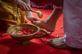 Preparing for Ngidak tagan or Nincak ndog, the ritual of stepping on raw chicken eggs by the groom at a traditional Javanese weddi