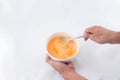 preparing omelet .Cooking of eggs in White Ceramic Bowl. Royalty Free Stock Photo