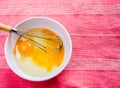 Preparing omelet with eegs and whisk Royalty Free Stock Photo