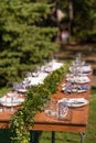 Preparing for an open-air party. Decorated with fresh flowers served tables. Table number. Decoration Details Royalty Free Stock Photo