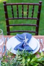 Preparing for an open-air party. Decorated with fresh flowers served tables. Table number. Decoration Details Royalty Free Stock Photo