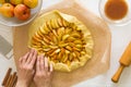 Preparing open pie or galette with apples Royalty Free Stock Photo