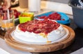 Preparing pavlova cake at home female hands