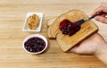 Preparing a Peanut butter and Jelly Sandwich Royalty Free Stock Photo