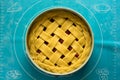 Preparing pie with berries on turquoise silicone baking mat