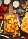 Preparing pumpkin, onions and sweet peppers for cooking Royalty Free Stock Photo