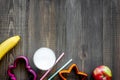 Preparing quick lunch for schoolchild. Fruits on dark wooden table background top view copyspace