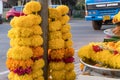 Garlands of orange flowers on the market in India. Hindu rituals