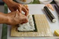 Preparing Rice and Seaweed before Rolling Sushi Roll by Using Bamboo Mat Royalty Free Stock Photo