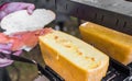 Preparing sandwich at street food market with salmon and raclette melted cheese Royalty Free Stock Photo