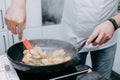 Preparing Sarsuella in a cooking mater class. Shrimp close-up. home-cooked food. prawns in a pan Royalty Free Stock Photo