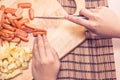 Preparing sausage and vegetables woman hands vintage tone