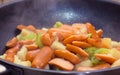 Preparing sausage and vegetables woman hands vintage tone