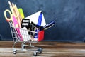 Preparing for school - shopping cart with school supplies over chalkboard Royalty Free Stock Photo