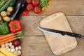 Preparing and slicing vegetables knife on cutting board Royalty Free Stock Photo