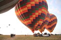 Preparing for take-off hot air balloons with tourists on sunrise Royalty Free Stock Photo