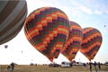 Preparing for take-off hot air balloons with tourists on sunrise Royalty Free Stock Photo