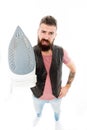 Preparing to ironing. Bearded man holding clothes iron. Hipster with electric ironing tool. Unshaven brutal man with Royalty Free Stock Photo