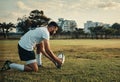 Preparing to take the big kick. Full length shot of a handsome young rugby player preparing for a kick while training on Royalty Free Stock Photo