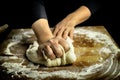 Woman hands kneading fresh dough for making bread or pizza. Royalty Free Stock Photo