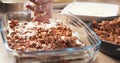 Preparing traditional italian lasagna adding cheese Royalty Free Stock Photo