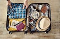 Preparing travel suitcase high angle view Royalty Free Stock Photo