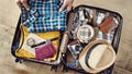 Preparing travel suitcase high angle view Royalty Free Stock Photo