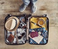 Preparing travel suitcase high angle view Royalty Free Stock Photo