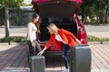 Preparing of two young girls friends for road trip Royalty Free Stock Photo