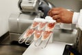 Preparing a vacuum packed ham board Royalty Free Stock Photo
