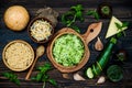 Preparing veggies cutlets or patties for burgers. Zucchini quinoa veggie burger with pesto sauce and sprouts. Top view, overhead Royalty Free Stock Photo