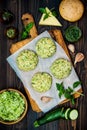 Preparing veggies cutlets or patties for burgers. Zucchini quinoa veggie burger with pesto sauce and sprouts. Top view, overhead Royalty Free Stock Photo