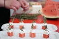 Preparing watermelon and feta cheese cubes Royalty Free Stock Photo