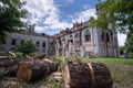 Preparing for winter stacking firewood in the yard of the medieval monastery