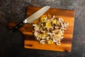 Sliced Wild Mushrooms with a Chef\'s Knife on a Wooden Cutting Board Royalty Free Stock Photo